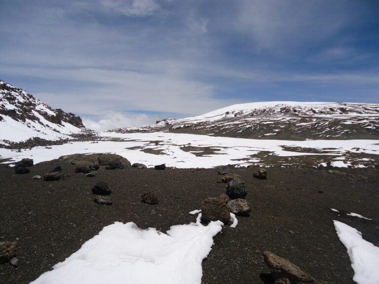 Snow and volcanic terrain on the upper slopes near Uhuru Peak on Mount Kilimanjaro.